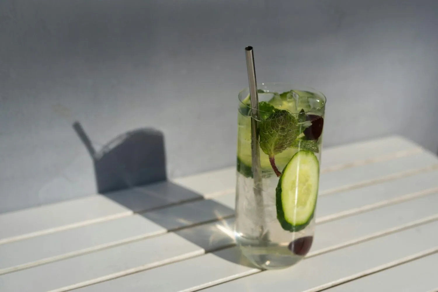 Refreshing mint cocktail in a tall glass with ice and fresh mint